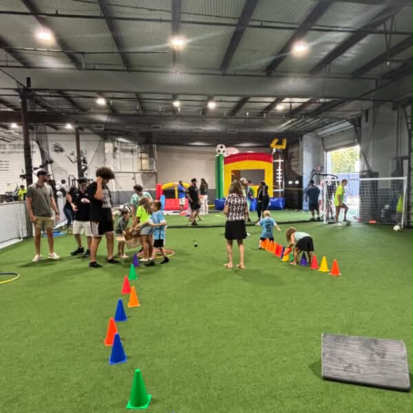 Families enjoying games and activities during the KG Elite Sports community opening