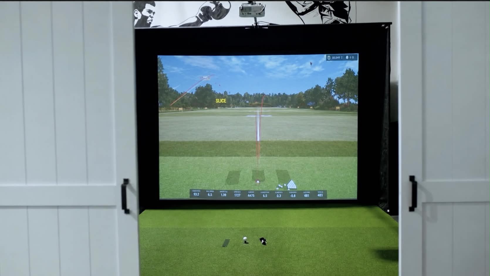 Golf simulator bay showing a virtual course and shot data